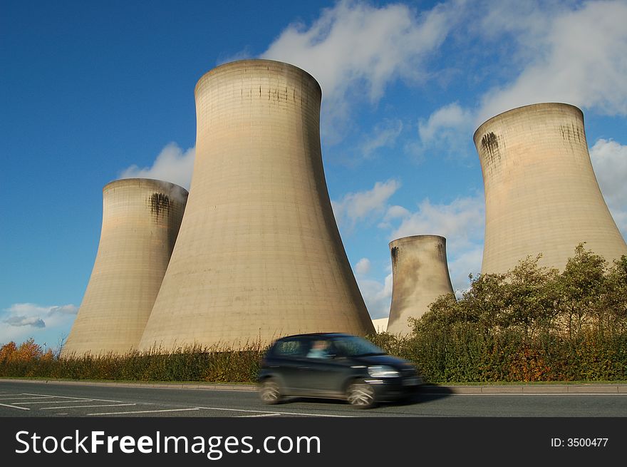 Roadside view of cooling towers in electricity plant