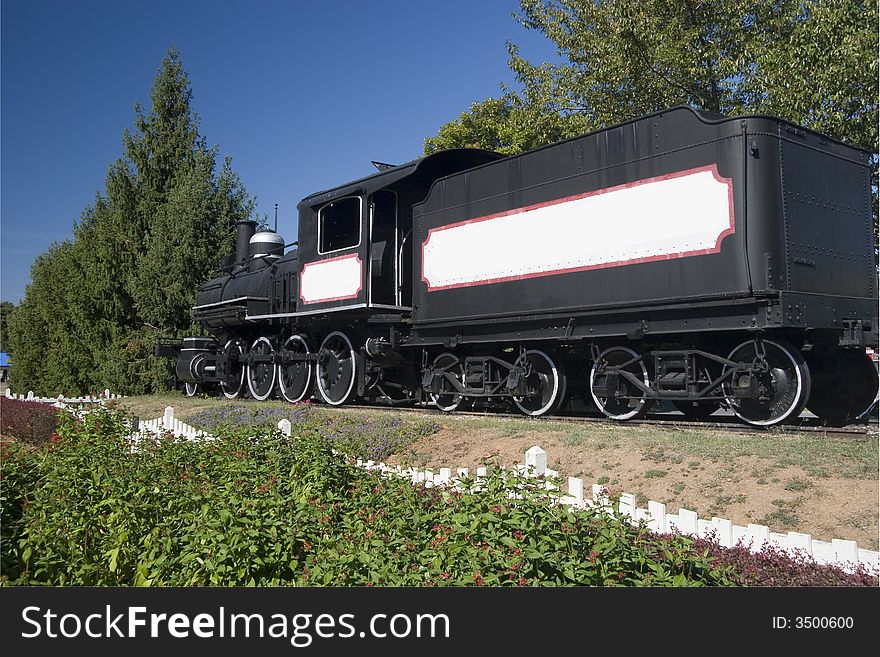 Black Train Engine on a Railroad Track