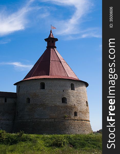 Ancient castle tower at sunny summer day