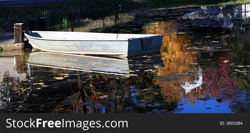Fall Row Boat Reflection