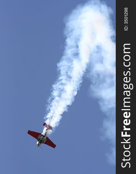 An acrobatic pilot showing his mastership at the Aviation Fest in Siauliai (Lithuania). An acrobatic pilot showing his mastership at the Aviation Fest in Siauliai (Lithuania).