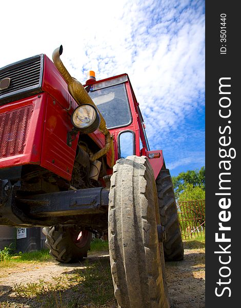 Tractor parked at a farm in summer