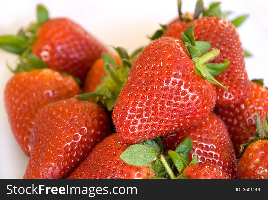 A close up of freshly picked red strawberries. A close up of freshly picked red strawberries