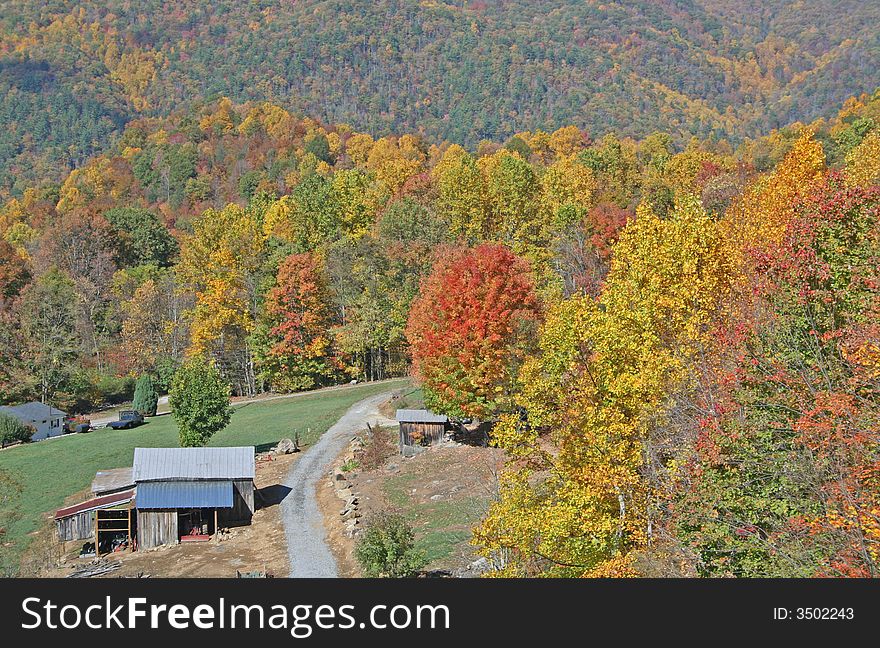 Colorful autumn mountain scene with rustic buildings. Colorful autumn mountain scene with rustic buildings