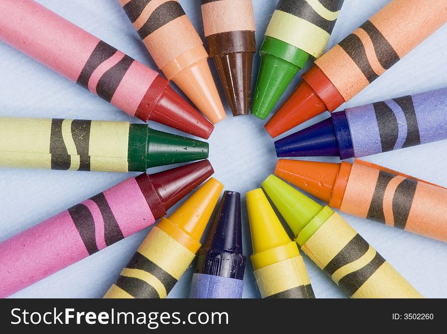 A closeup of a circle of colorful crayons. A closeup of a circle of colorful crayons.