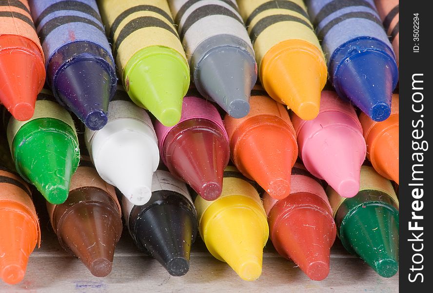 A closeup of a stack of colorful crayons. A closeup of a stack of colorful crayons.