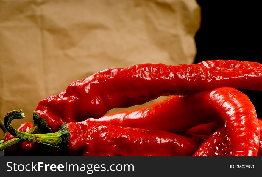 Red Hot chili peppers on brown paper bag background