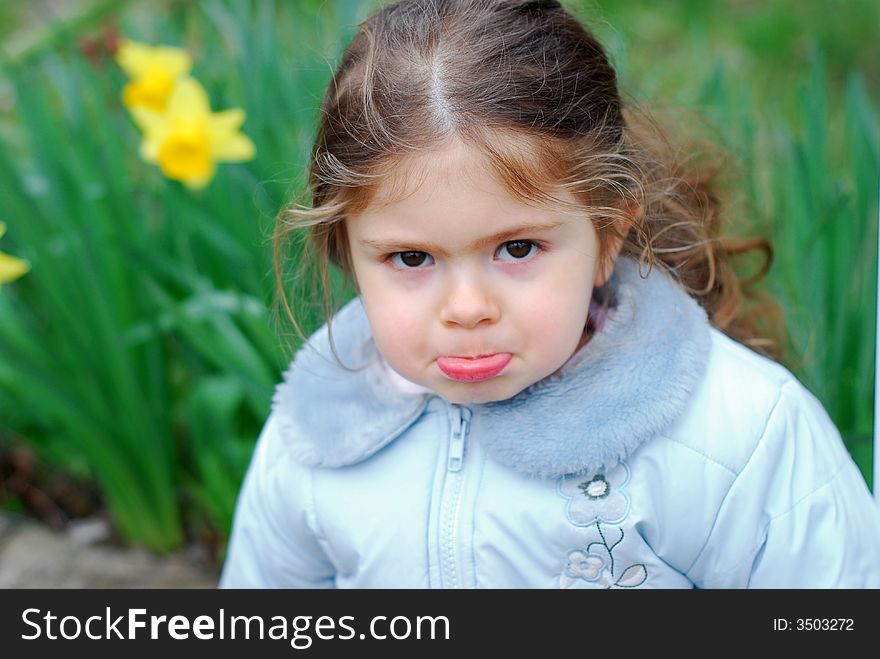 Beautiful girl with face expression, yellow flower in backround. Beautiful girl with face expression, yellow flower in backround