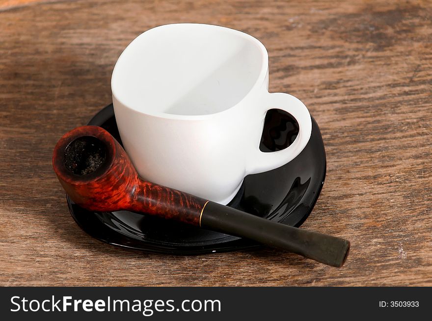 Pipe and white cup