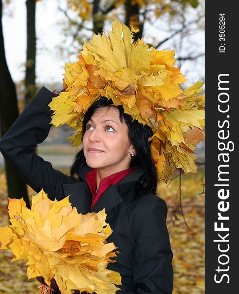 Young woman in diadem from leaves and autumn. Young woman in diadem from leaves and autumn