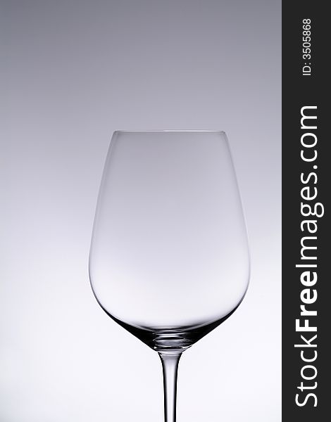 Wine glass, isolated studio shot on gradated background. Wine glass, isolated studio shot on gradated background.