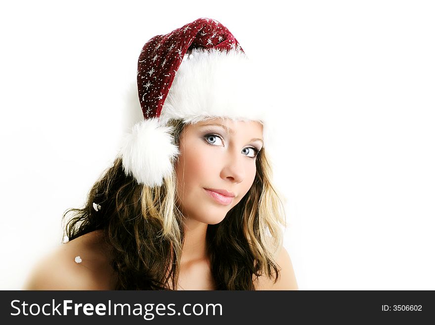 Winter portrait of a beautiful young woman with a cap against white background. Winter portrait of a beautiful young woman with a cap against white background