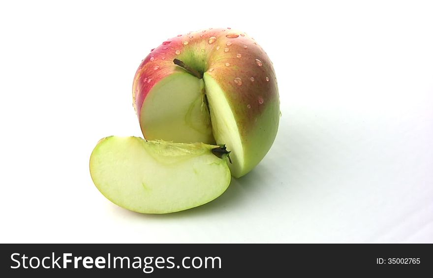 Natural fresh juicy apple with a truncated segment rotates, showing itself on all sides. Natural fresh juicy apple with a truncated segment rotates, showing itself on all sides