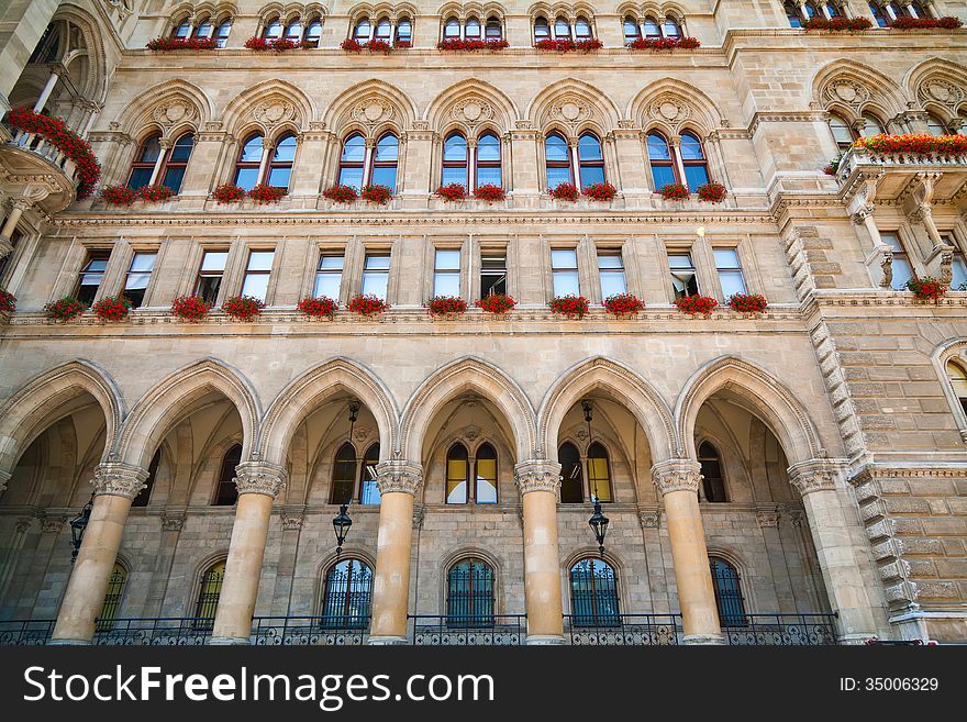 Part of the Rathaus in Vienna with windows decorated with flowers. Part of the Rathaus in Vienna with windows decorated with flowers