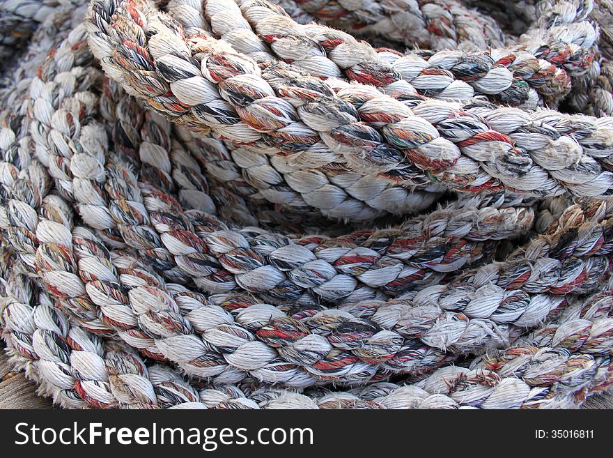 A rope coiled on the deck of a ship. A rope coiled on the deck of a ship
