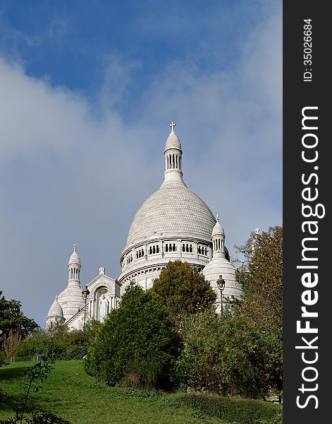 An unusual view of Sacre Coeur church in Paris in France. Sacre Coeur is one of the most famous churches in all France. Situated on the hills of Montmartre it is one of the big tourist spots in Paris. An unusual view of Sacre Coeur church in Paris in France. Sacre Coeur is one of the most famous churches in all France. Situated on the hills of Montmartre it is one of the big tourist spots in Paris.