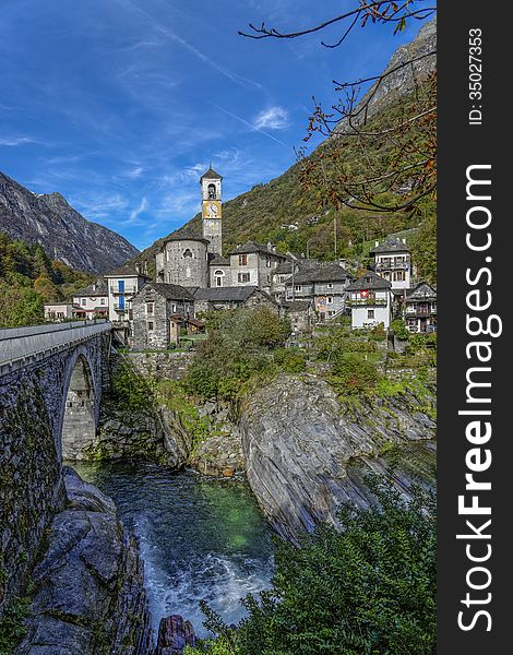 The small village of Lavertezzo in the Ticino canton of Switzerland is beautifully situated near the Verzasca River which is famous for its blue-green waters. The small village of Lavertezzo in the Ticino canton of Switzerland is beautifully situated near the Verzasca River which is famous for its blue-green waters.