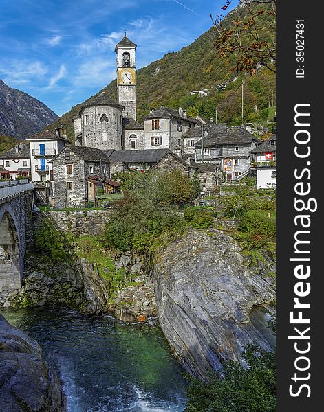 The small village of Lavertezzo in the Ticino canton of Switzerland is beautifully situated near the Verzasca River which is famous for its blue-green waters. The small village of Lavertezzo in the Ticino canton of Switzerland is beautifully situated near the Verzasca River which is famous for its blue-green waters.