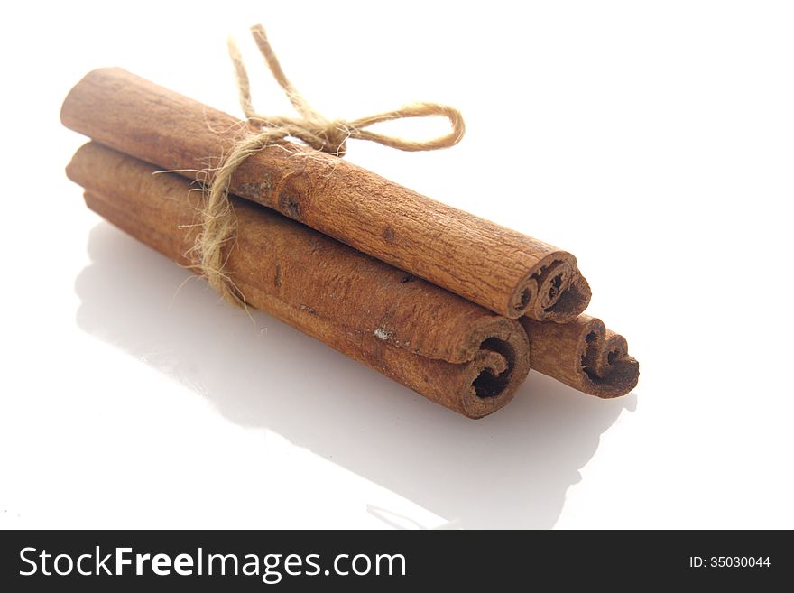 Three stick of Cinnamon over white background