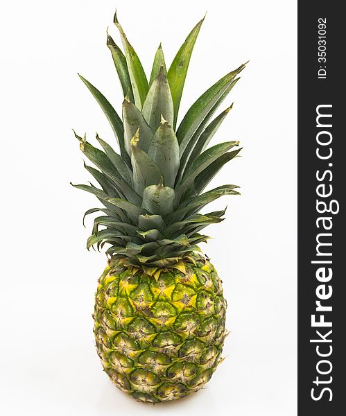 Diagonal photo of a fresh pineapple on a white background. Diagonal photo of a fresh pineapple on a white background