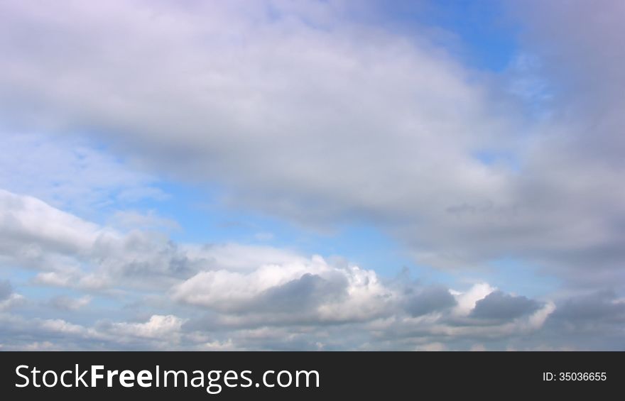 Cumulus clouds on a background of blue sky. Timelapse. Cumulus clouds on a background of blue sky. Timelapse