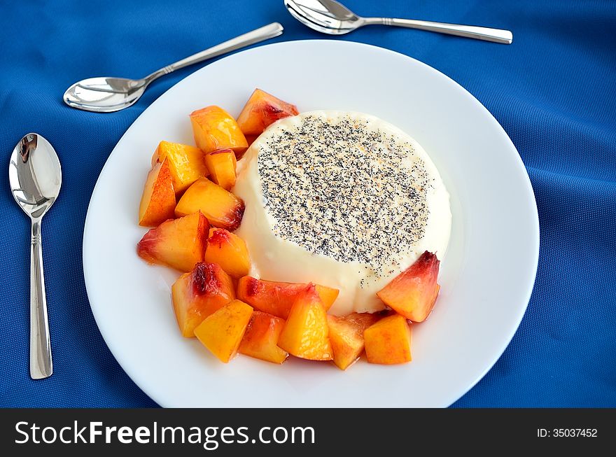 Creamy dessert panncotta with peachs