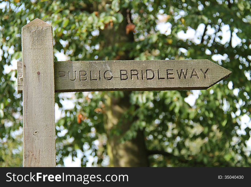 A Public Bridleway Sign on a Countryside Track. A Public Bridleway Sign on a Countryside Track.