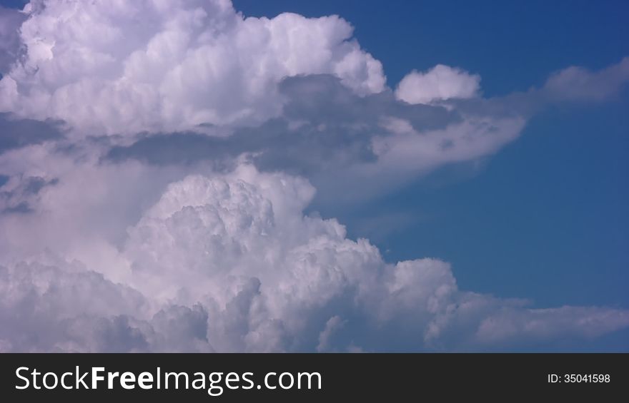 Cumulus clouds on a background of blue sky. Timelapse. Cumulus clouds on a background of blue sky. Timelapse