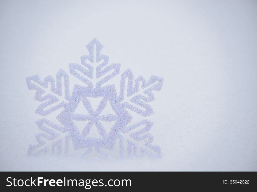 Christmas Background with Beautiful Snowflake on the Snow. Space for Text