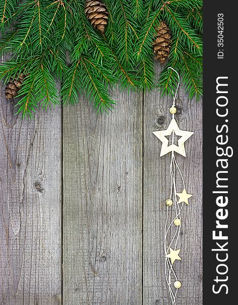 Christmas fir tree with stars decoration on wooden board. Christmas fir tree with stars decoration on wooden board