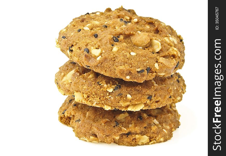 Tower stack of three whole grains cookies on white background. Tower stack of three whole grains cookies on white background