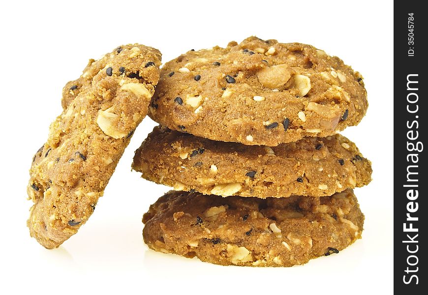 Stack of delicious whole grains cookies on white background. Stack of delicious whole grains cookies on white background