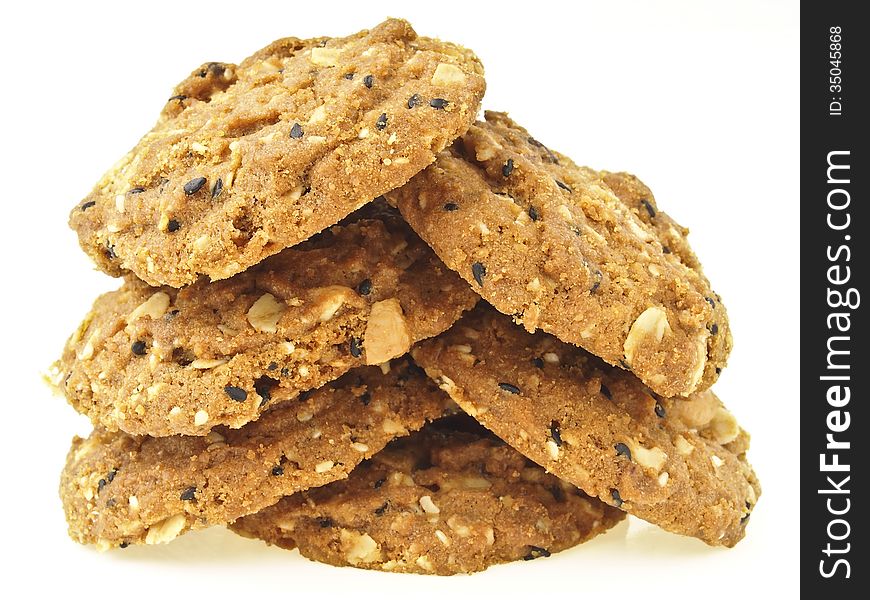 Stack of whole grains cookies in tree shape on white background. Stack of whole grains cookies in tree shape on white background