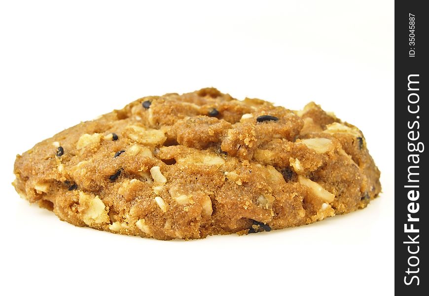 Piece of whole grains cookies on white background