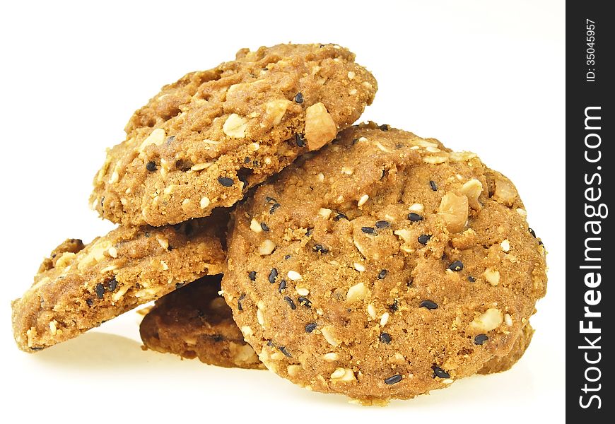 Pile of delicious whole grains cookies on white background. Pile of delicious whole grains cookies on white background