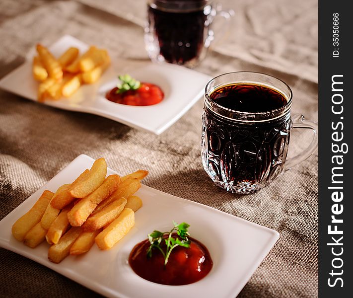 French fries and sauce dish with the Russian kvass. French fries and sauce dish with the Russian kvass