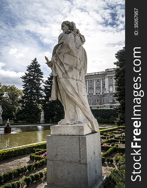 Royal Palace in Madrid with blue sky and sculpture. Royal Palace in Madrid with blue sky and sculpture