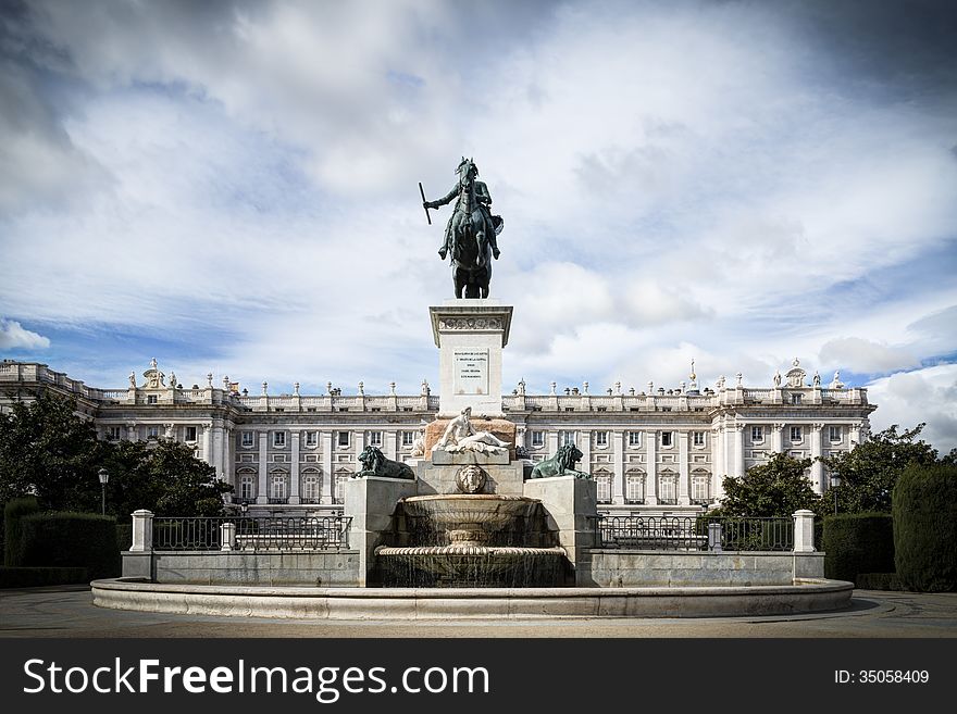 Royal Palace in Madrid with blue sky and sculpture. Royal Palace in Madrid with blue sky and sculpture