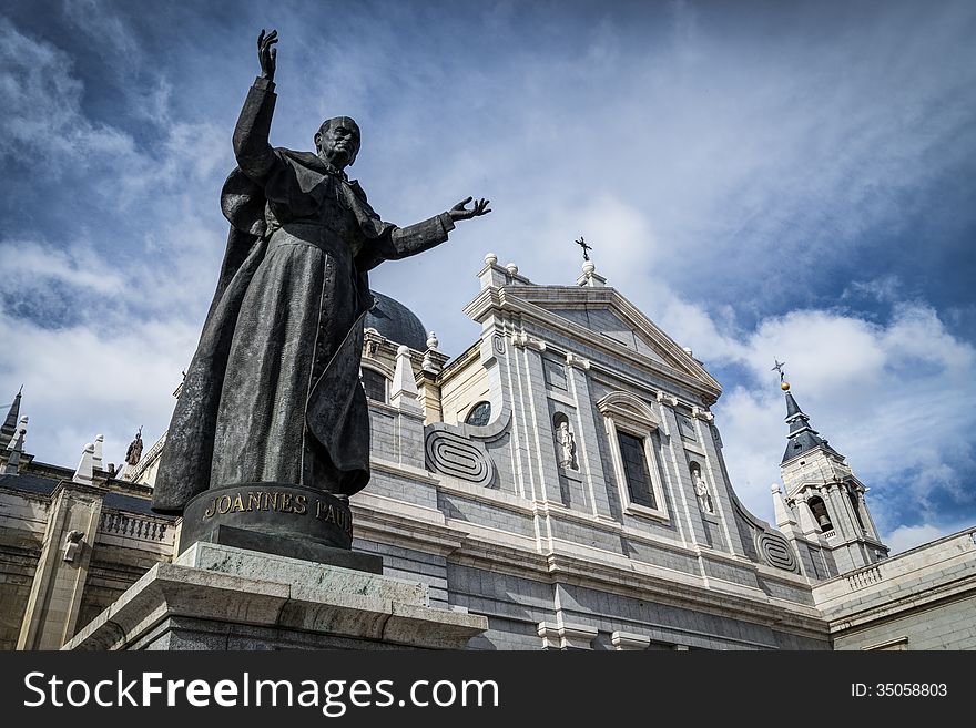Almudena Cathedral with Pope John Paul II sculpture in Madrid closed up