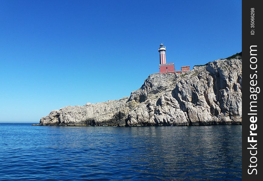 Old lighthouse on a cliff on Capri Island, Italy.