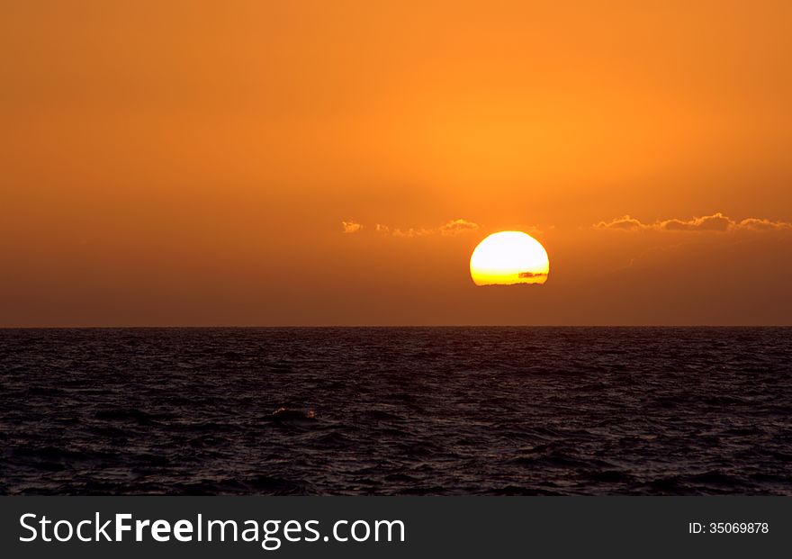 Sunset and few clouds at Atlantic Ocean. Sunset and few clouds at Atlantic Ocean