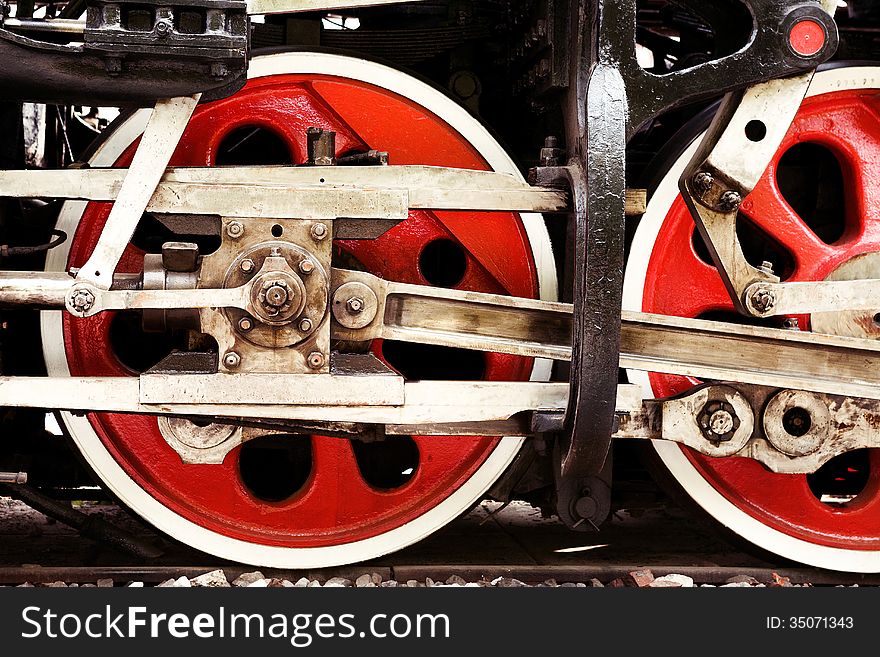 Red wheels close-up of an old steam locomotive. Red wheels close-up of an old steam locomotive