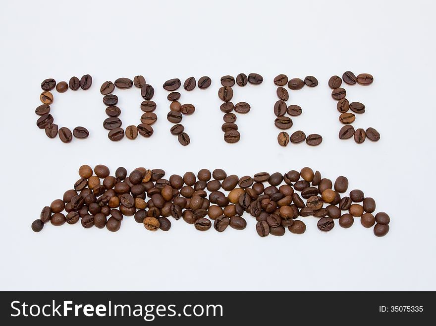 The word coffee made ​​by coffee beans isolated on white background. The word coffee made ​​by coffee beans isolated on white background