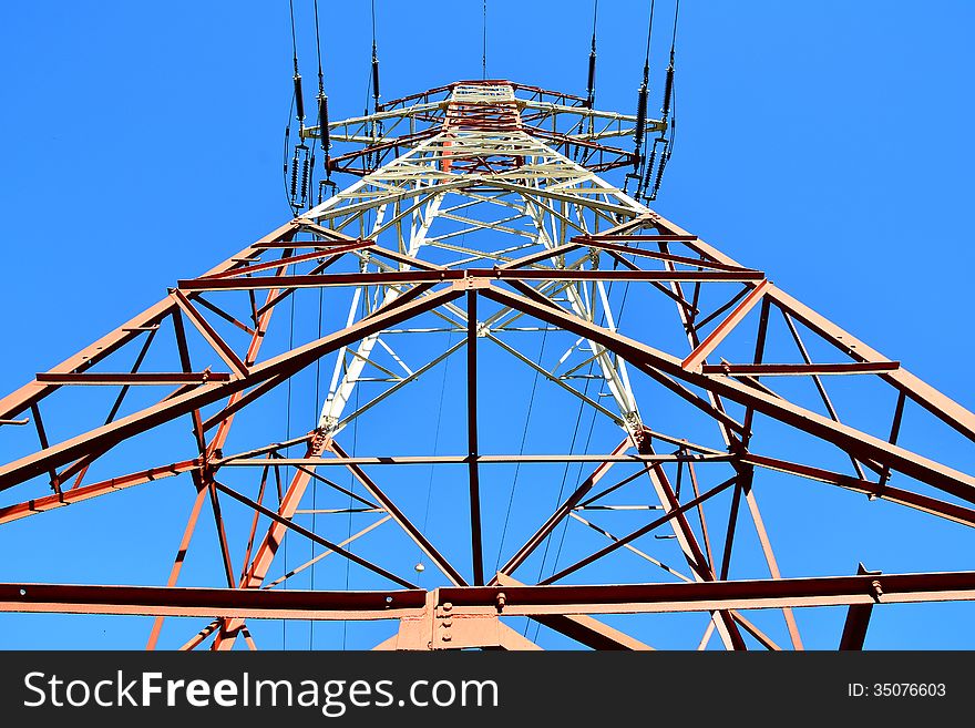 High-voltage Tower And Sky Background.