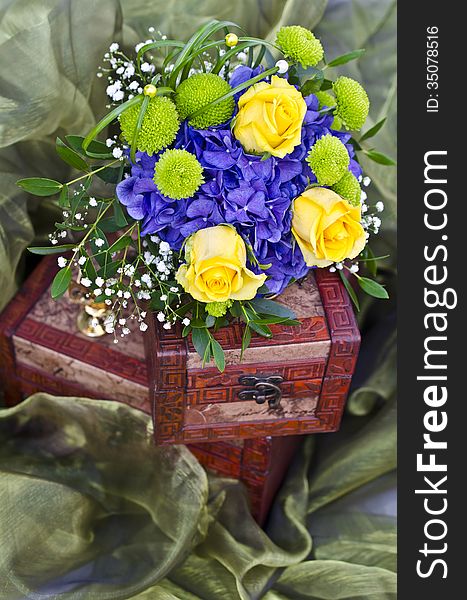 Bridal bouquet with yellow roses on wooden box. Bridal bouquet with yellow roses on wooden box