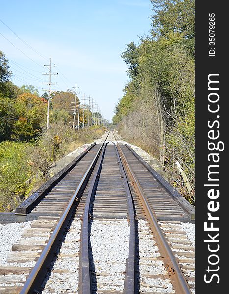 Railroad tracks slicing through the rural Michigan countryside. Railroad tracks slicing through the rural Michigan countryside