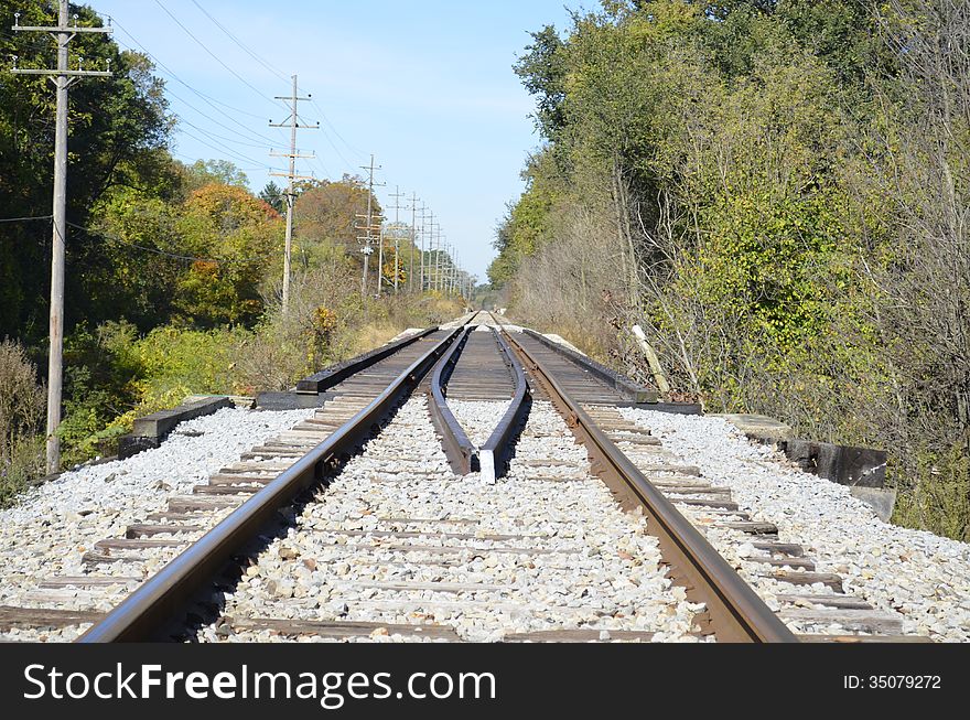 Railroad tracks slicing through the rural Michigan countryside. Railroad tracks slicing through the rural Michigan countryside