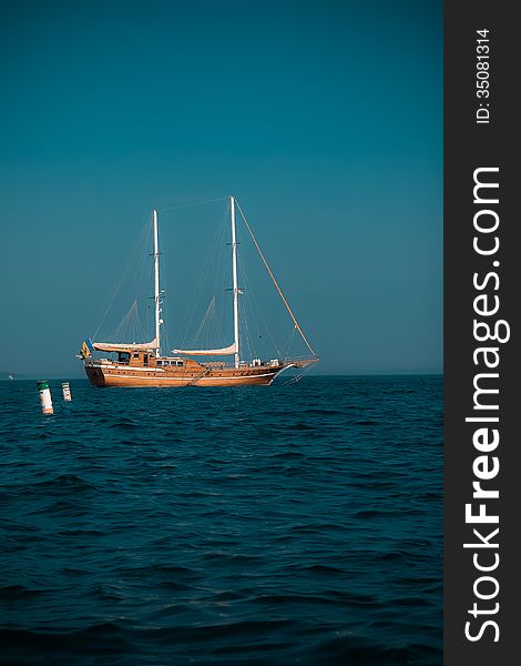 An old ship in a dark blue sea