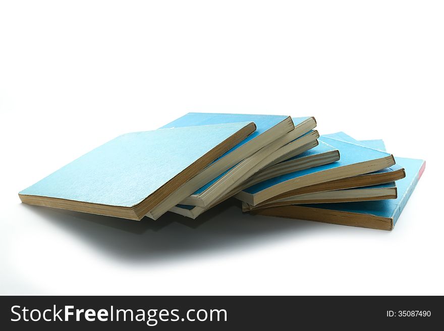 Pile of old blue hard cover books isolated on white. Pile of old blue hard cover books isolated on white