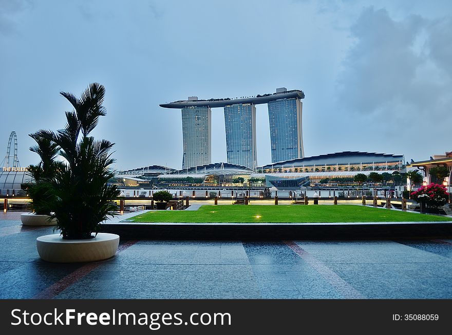 Marina Bay Sands is an Integrated Resort fronting Marina Bay in Singapore. Developed by Las Vegas Sands (LVS), it is billed as the world's most expensive standalone casino property at US$5.7 billion, including cost of the prime land. Marina Bay Sands is situated on 15.5 hectares of land with a built up area of 581,000 square metres of Gross Floor Area. iconic design have transformed the Singapore's skyline and its tourism landscape since it opened on 27 April 2010. The property has a hotel, convention and exhibition facilities, theatres, entertainment venues and shopping and dining retailers.